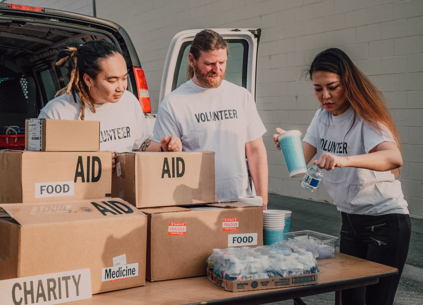 Volunteers packing boxes of food aid